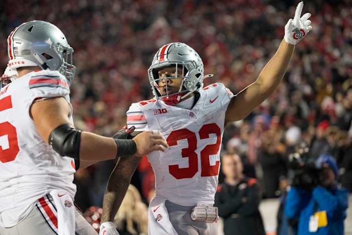 Oct 28, 2023; Madison, Wisconsin, USA; Ohio State Buckeyes running back TreVeyon Henderson (32) celebrates after scoring a touchdown during the fourth quarter against the Wisconsin Badgers at Camp Randall Stadium.